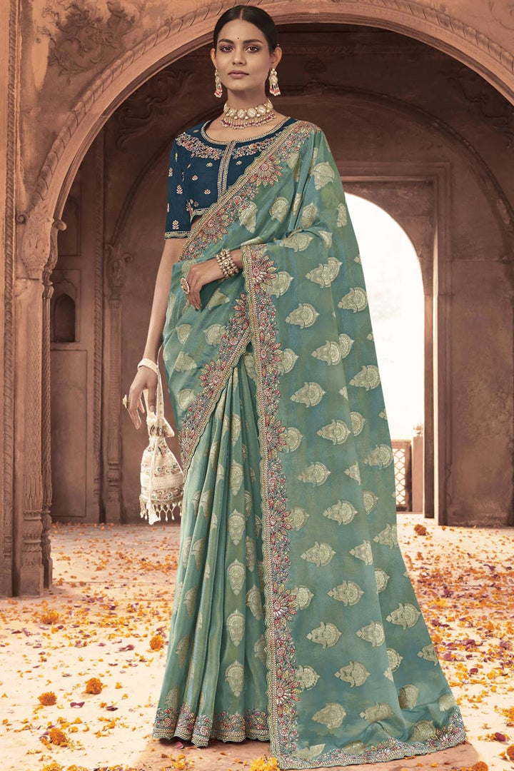 Engaging Sea Green Color Tissue Silk Saree With Embroidered Work
