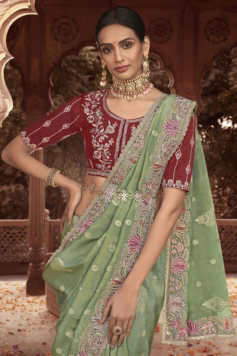 Incredible Embroidered Work On Green Color Tissue Silk Saree