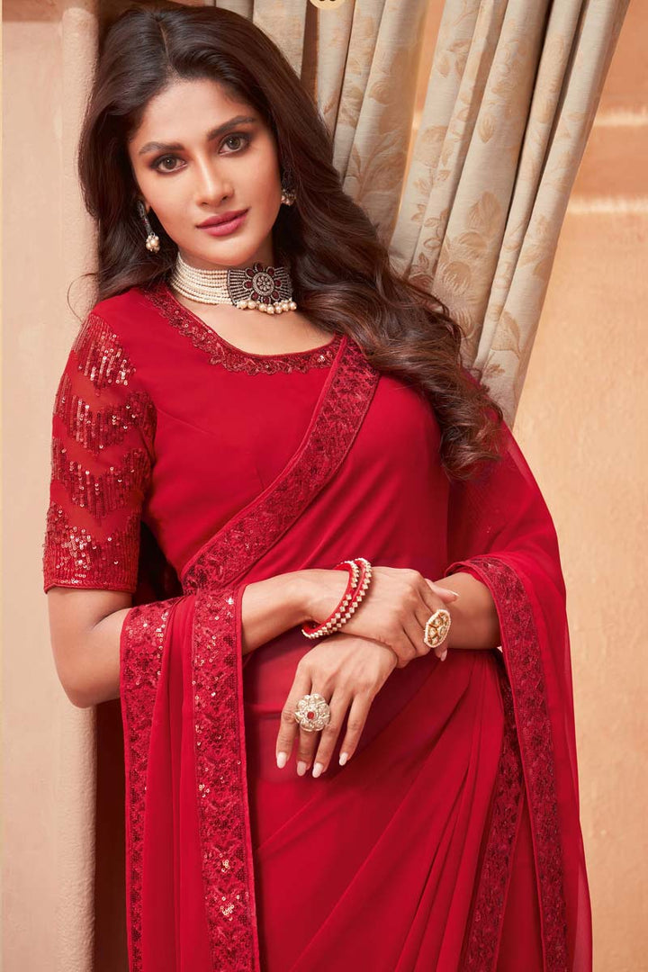 Red Color Mesmeric Sequins Border Work On Function Wear Saree In Georgette Silk Fabric
