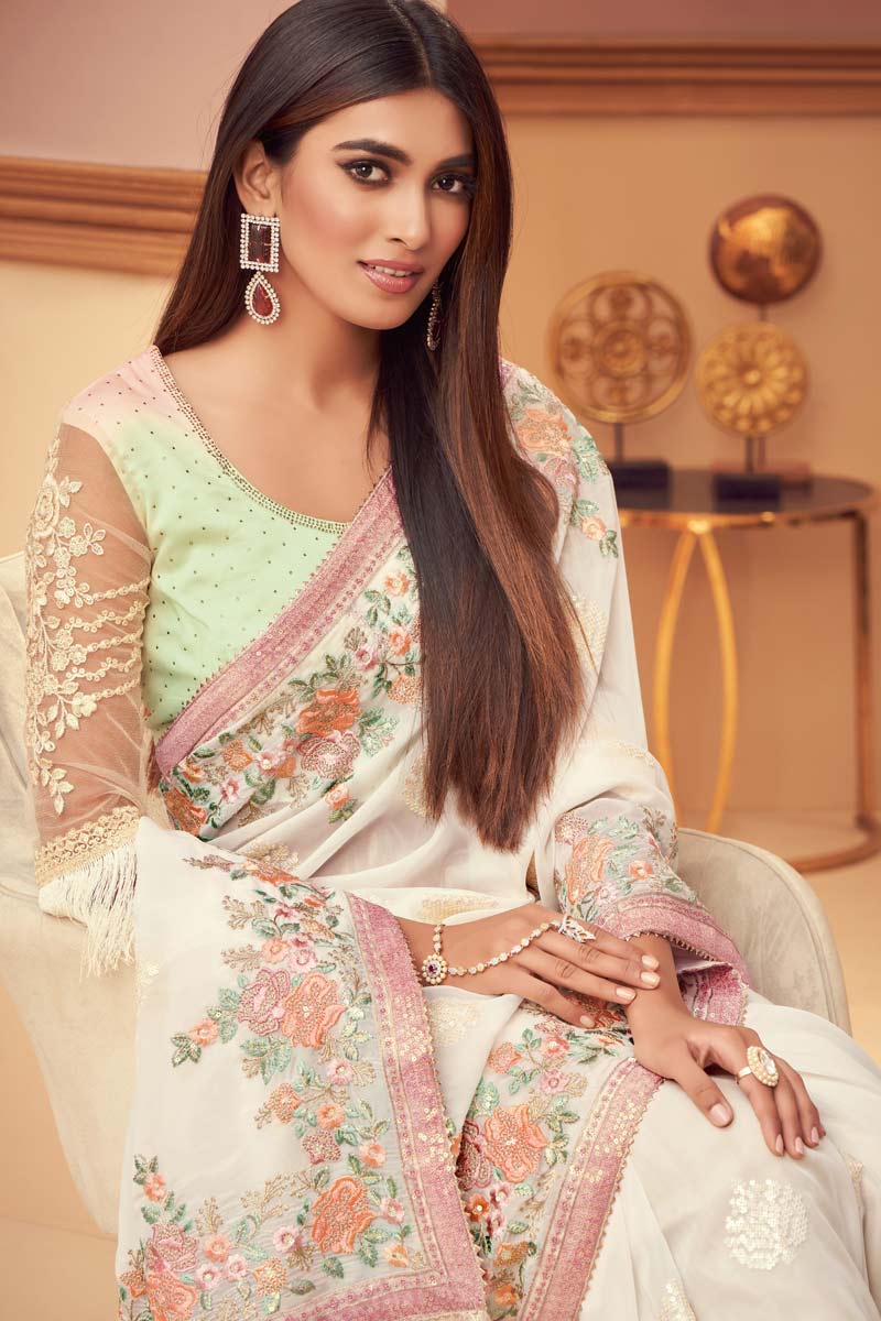 Marvelous Embroidered Work On Georgette Silk Fabric Party Wear Saree In Cream Color