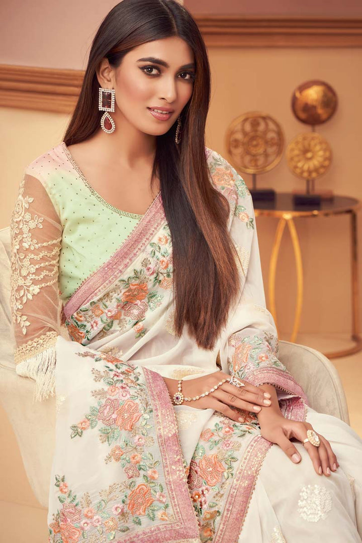 Marvelous Embroidered Work On Georgette Silk Fabric Party Wear Saree In Cream Color