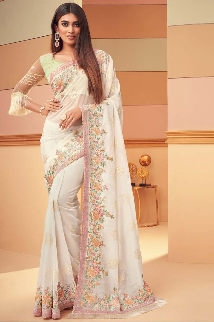 Marvelous Embroidered Work On Georgette Silk Fabric Party Wear Saree In Cream Color