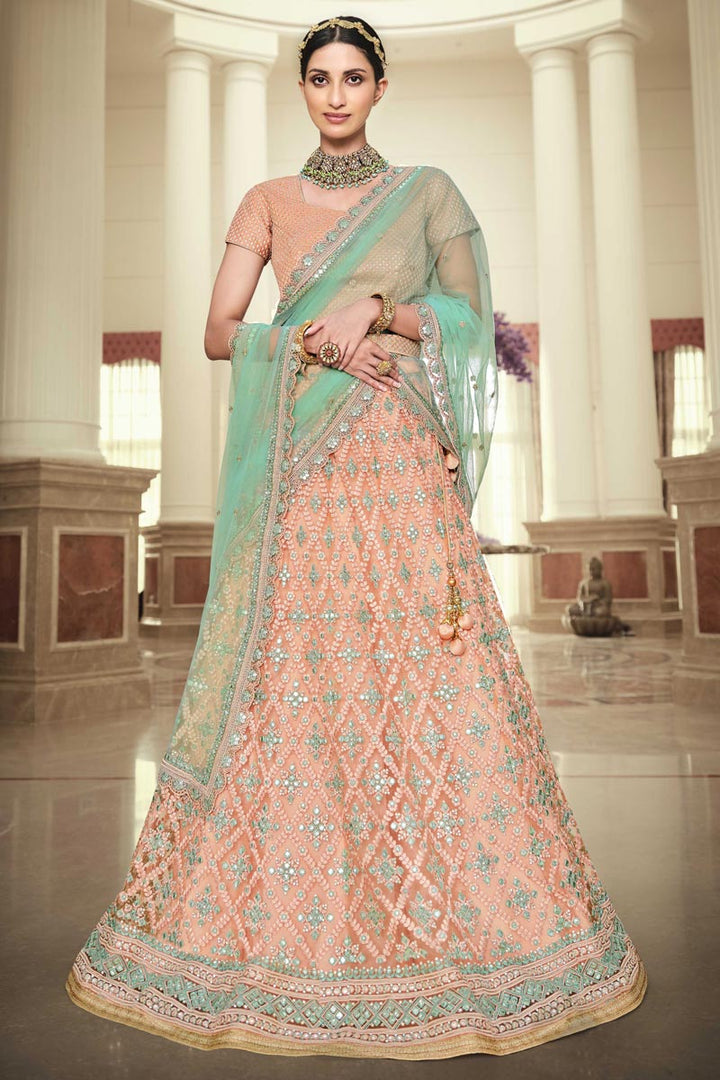 Designer Embroidered Wedding Wear Lehenga Choli In Peach Color Net Fabric
