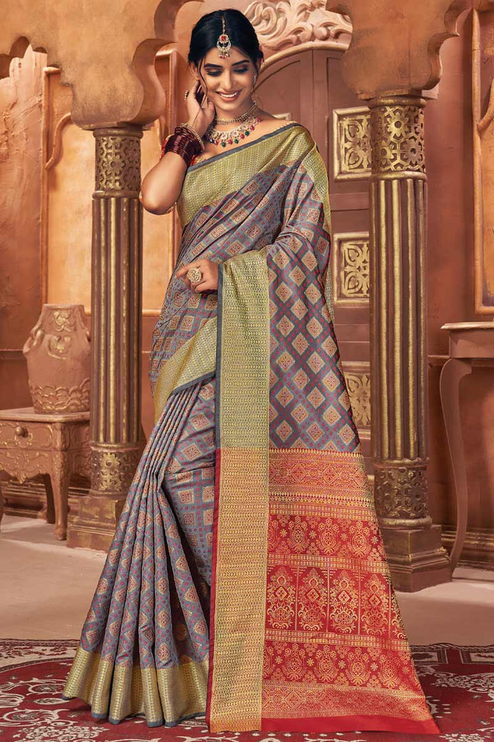 Beguiling Jacquard Work On Grey Color Art Silk Fabric Festival Wear Patola Style Saree