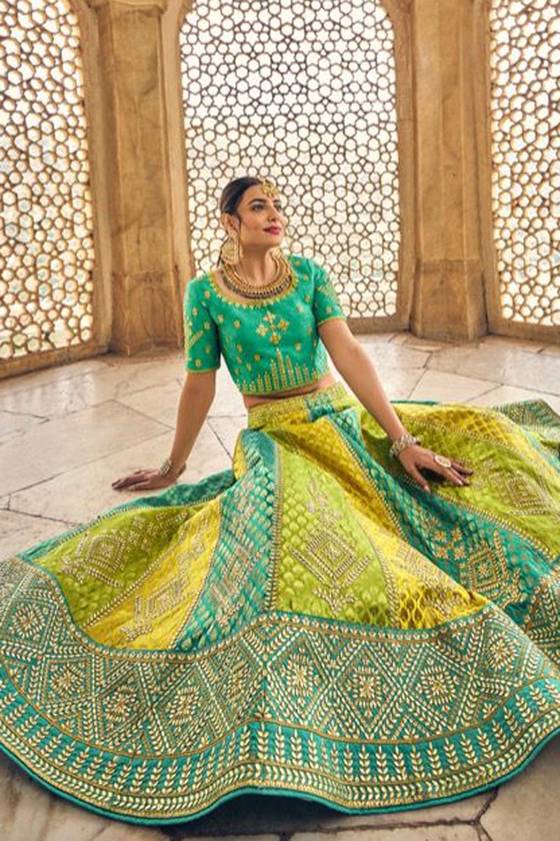 Wedding Wear Banarasi Silk Fabric Yellow Color Attractive Lehenga