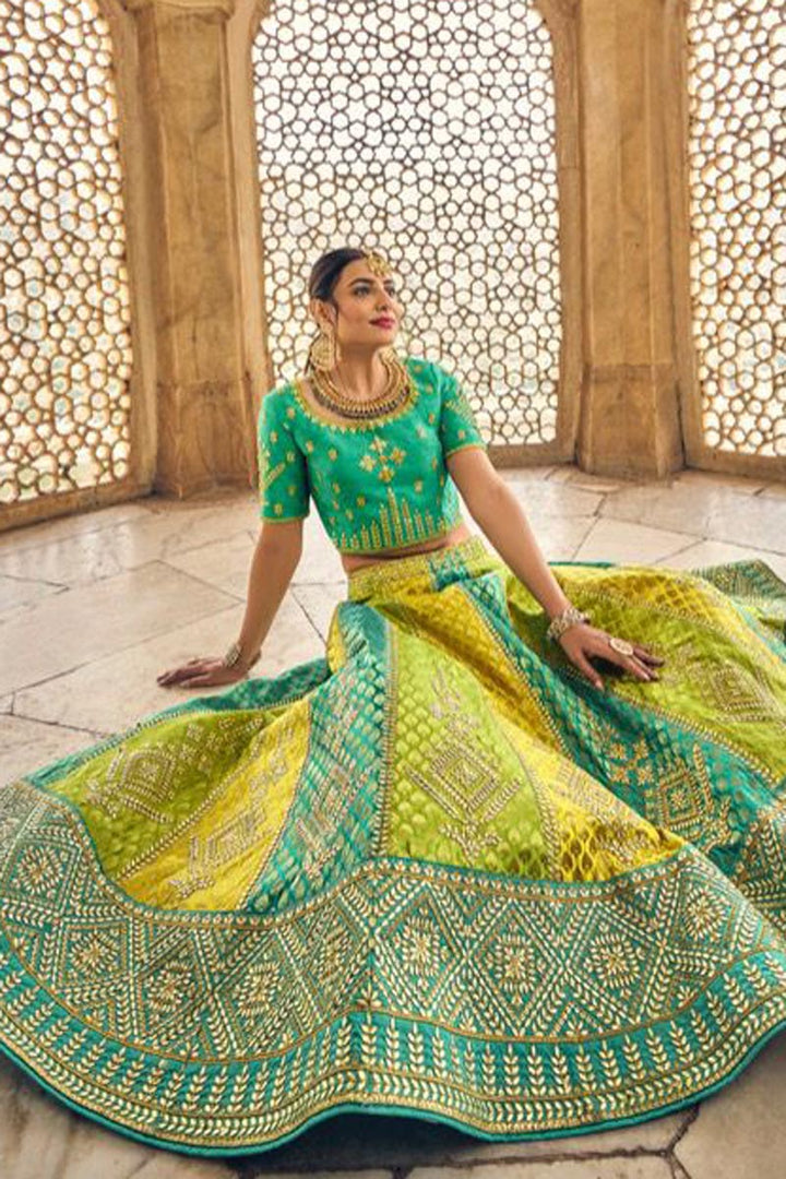 Wedding Wear Banarasi Silk Fabric Yellow Color Attractive Lehenga