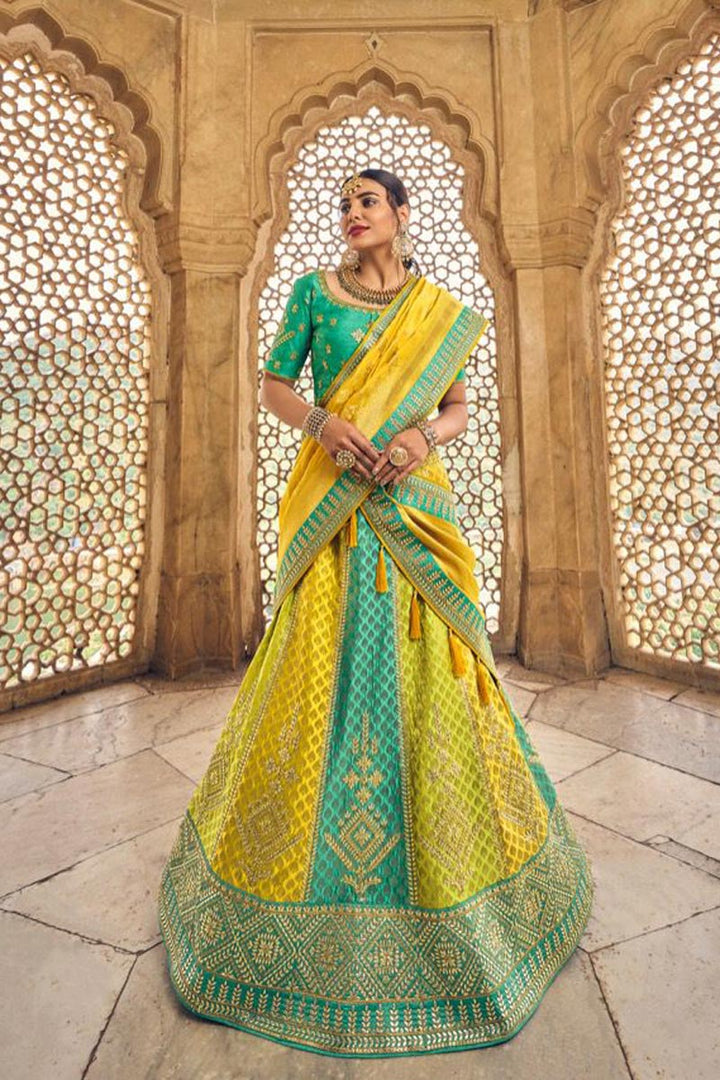 Wedding Wear Banarasi Silk Fabric Yellow Color Attractive Lehenga