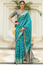 Load image into Gallery viewer, Tempting Patola Silk Fabric Cyan Color Saree
