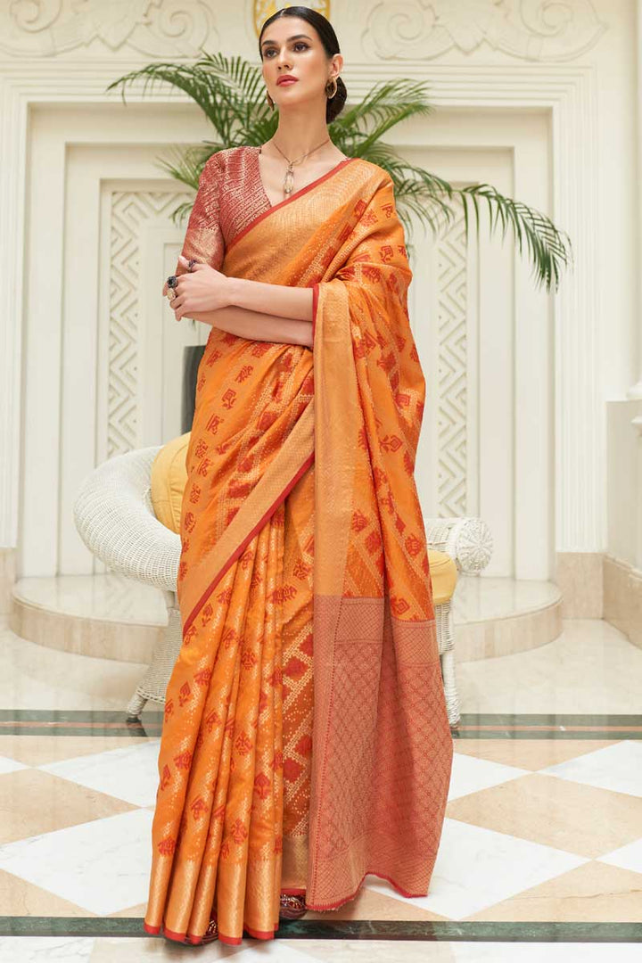Engaging Orange Color Patola Silk Fabric Saree