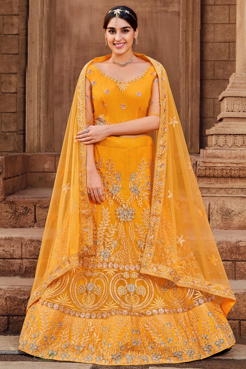 Net Fabric Brilliant Function Wear Lehenga In Yellow Color