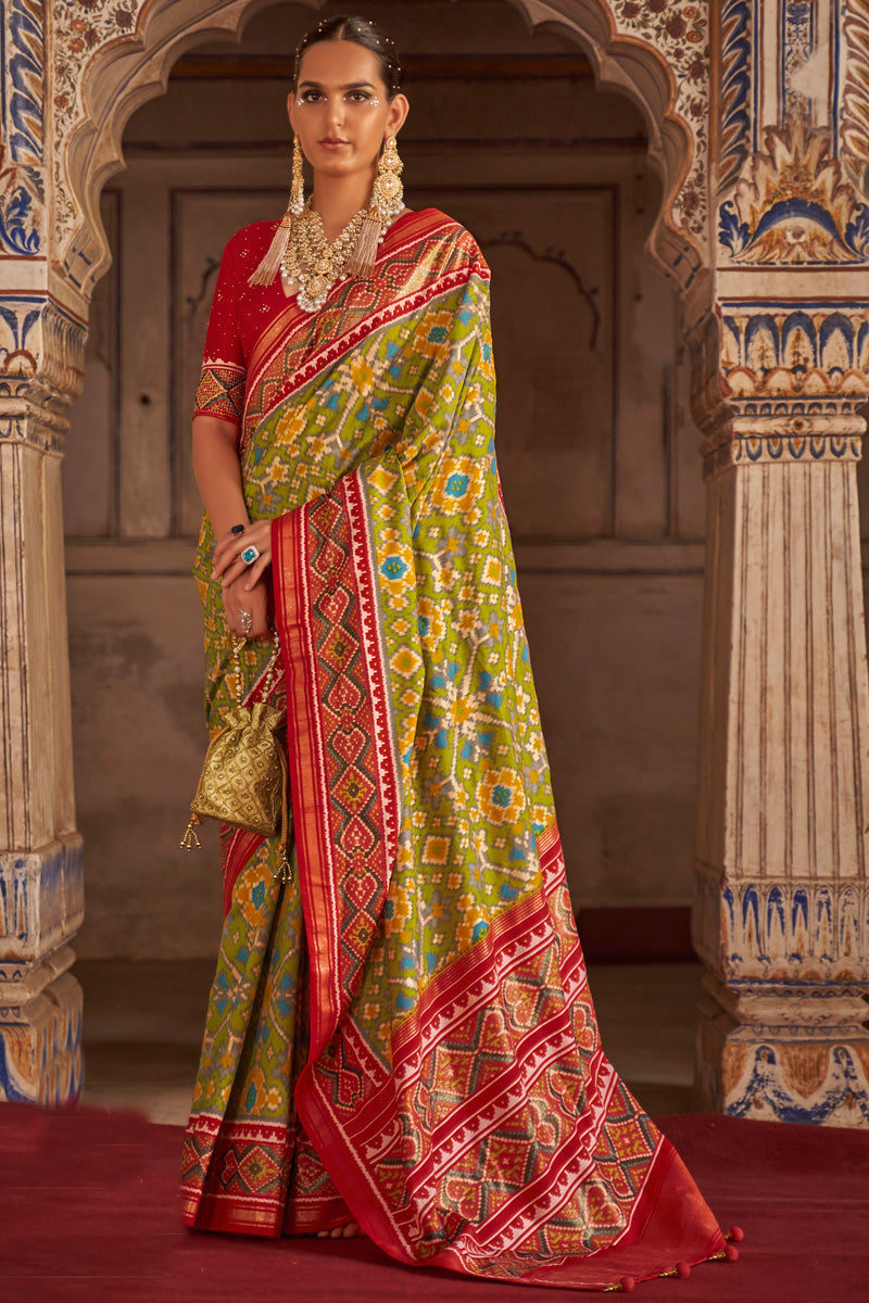 Soothing Printed Patola Silk Saree In Green Color