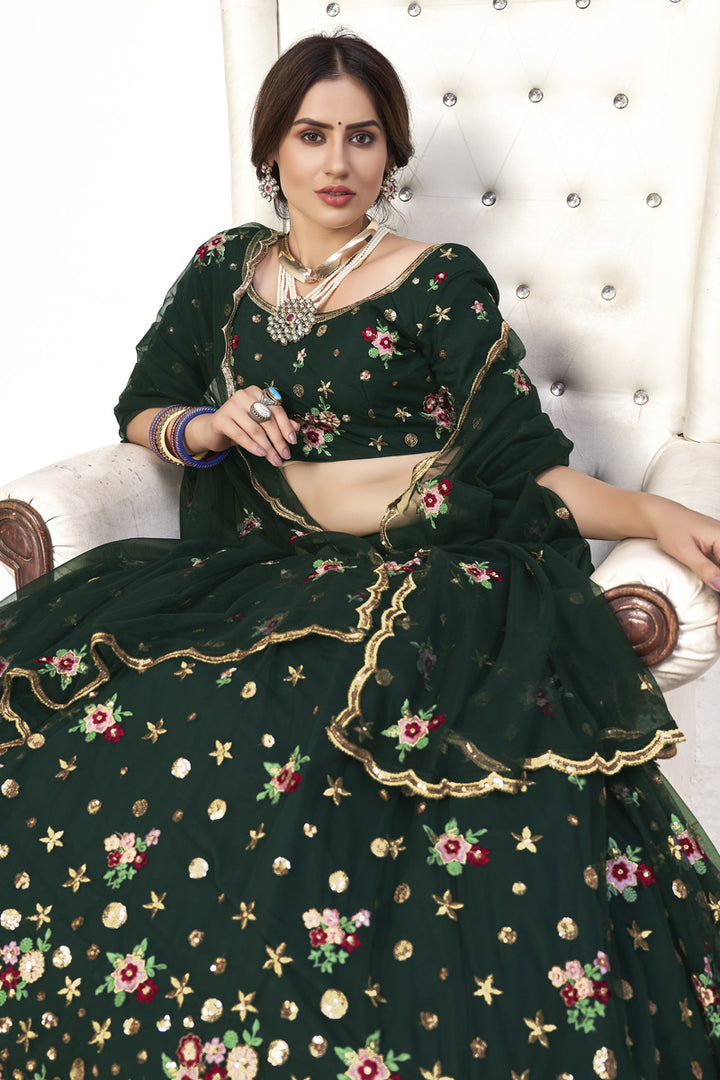 Attractive Sangeet Wear Dark Green Color Embroidered Lehenga In Net Fabric