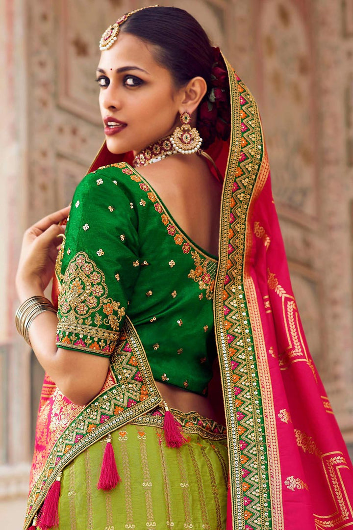 Graceful Silk Weaving Work Lehenga Choli In Green Color