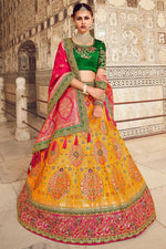 Load image into Gallery viewer, Mustard Color Silk Fabric Weaving Work Reception Wear Gorgeous Lehenga
