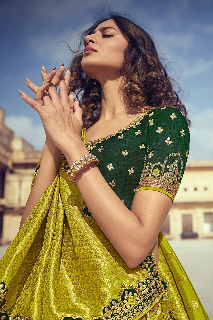 Wedding Wear Silk Fabric Embroidered Lehenga Choli In Green Color