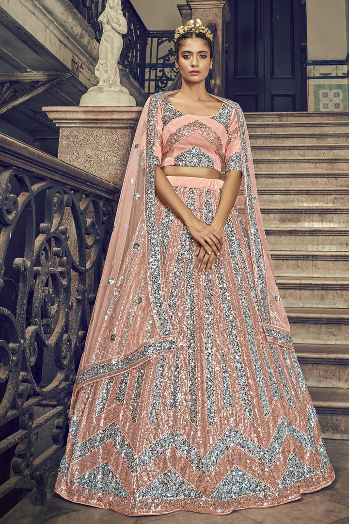Sangeet Wear Net Fabric Sequins Work Peach Color Lehenga Choli