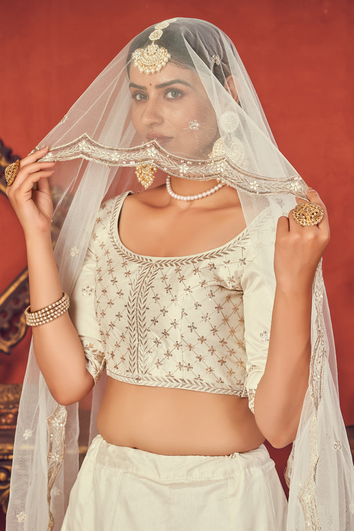 Off White Color Art Silk Fabric Fancy Embroidered Wedding Wear Lehenga Choli
