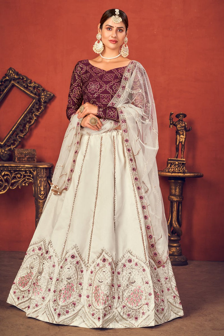 Art Silk Fabric Wedding Wear Off White Color Embroidered Lehenga Choli