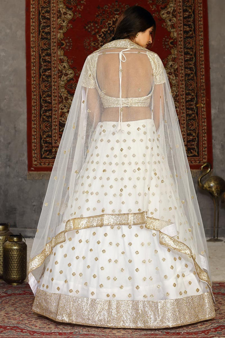 Sangeet Wear Net Fabric Sequins Work Lehenga Choli In White Color