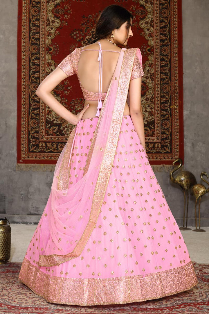 Pink Color Reception Wear Net Fabric Sequins Work Lehenga Choli