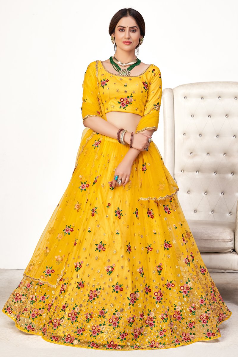 Wedding Wear Net Fabric Embroidered Lehenga Choli In Yellow Color