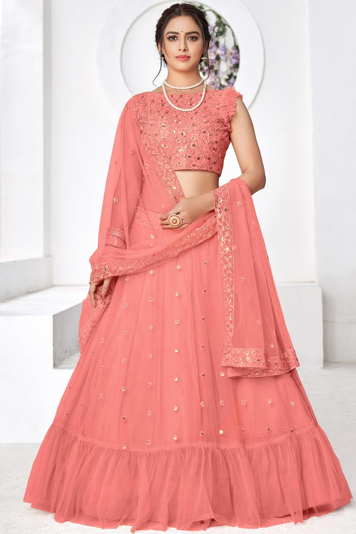 Gorgeous Peach Embroidered Sangeet Wear Lehenga Choli In Net Fabric