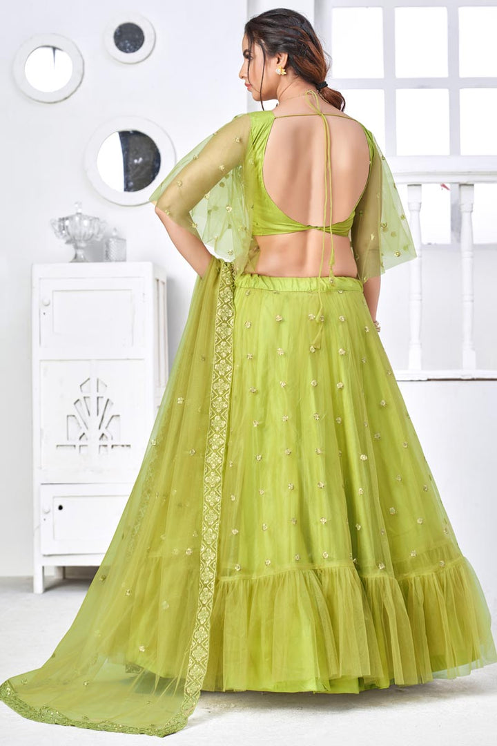 Pretty Net Fabric Embroidered Sangeet Wear Lehenga Choli In Green Color