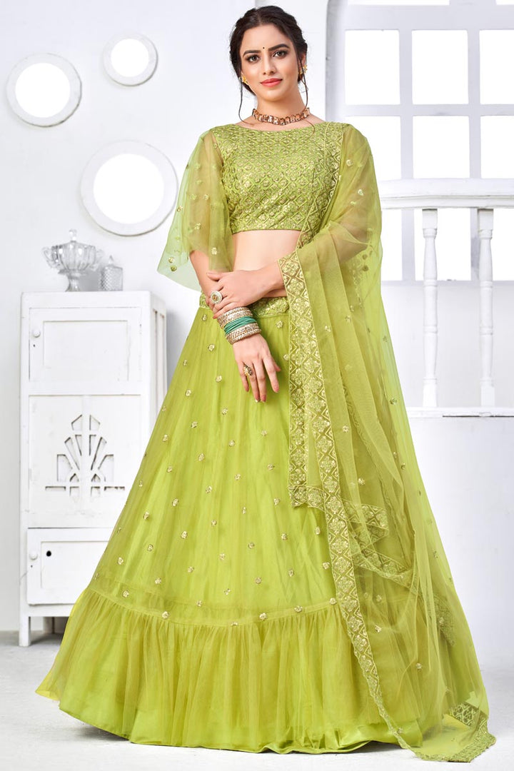 Pretty Net Fabric Embroidered Sangeet Wear Lehenga Choli In Green Color