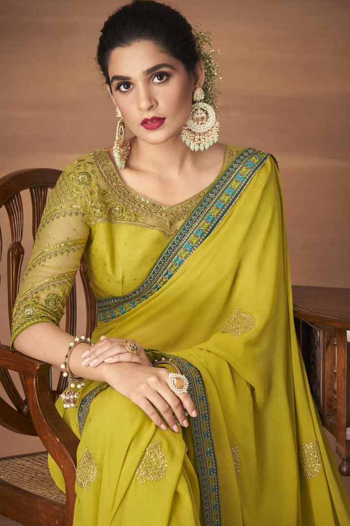 Party Wear Georgette Fabric Yellow Color Ingenious Embroidered Work Saree