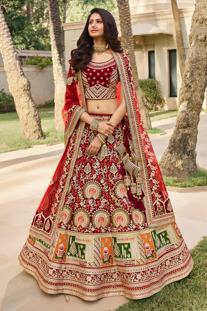Velvet Fabric Embroidered Wedding Wear Lehenga Choli In Maroon Color