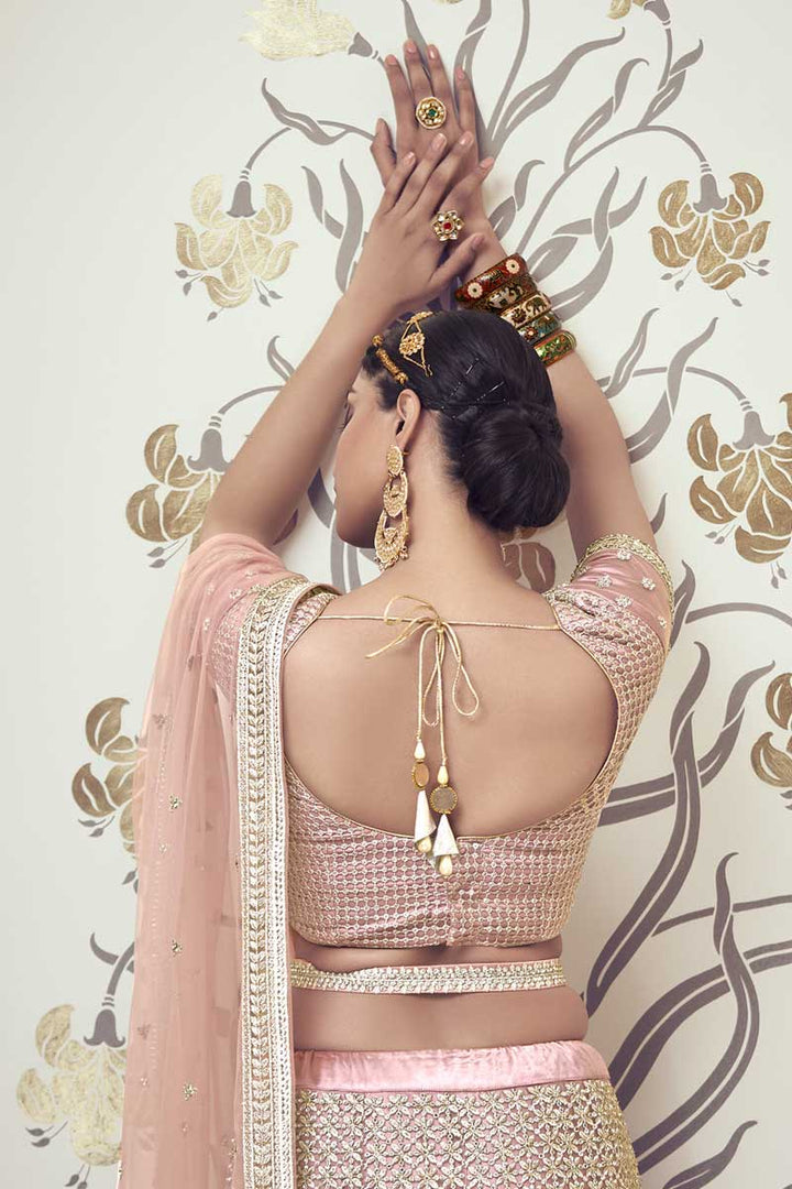 Sangeet Wear Stunning Peach Color Lehenga Choli In Net Fabric