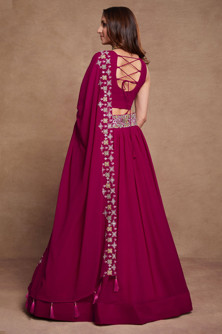 Georgette Fabric Sangeet Wear Embroidered Lehenga Choli In Rani Color
