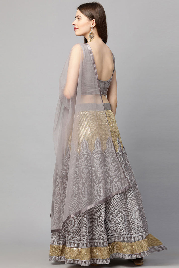 Embroidered Net Fabric Luxurious Lehenga In Lavender Color