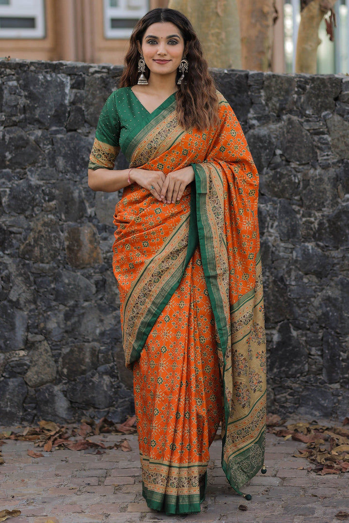 Dola Silk Fabric Printed Patola Saree In Orange Color