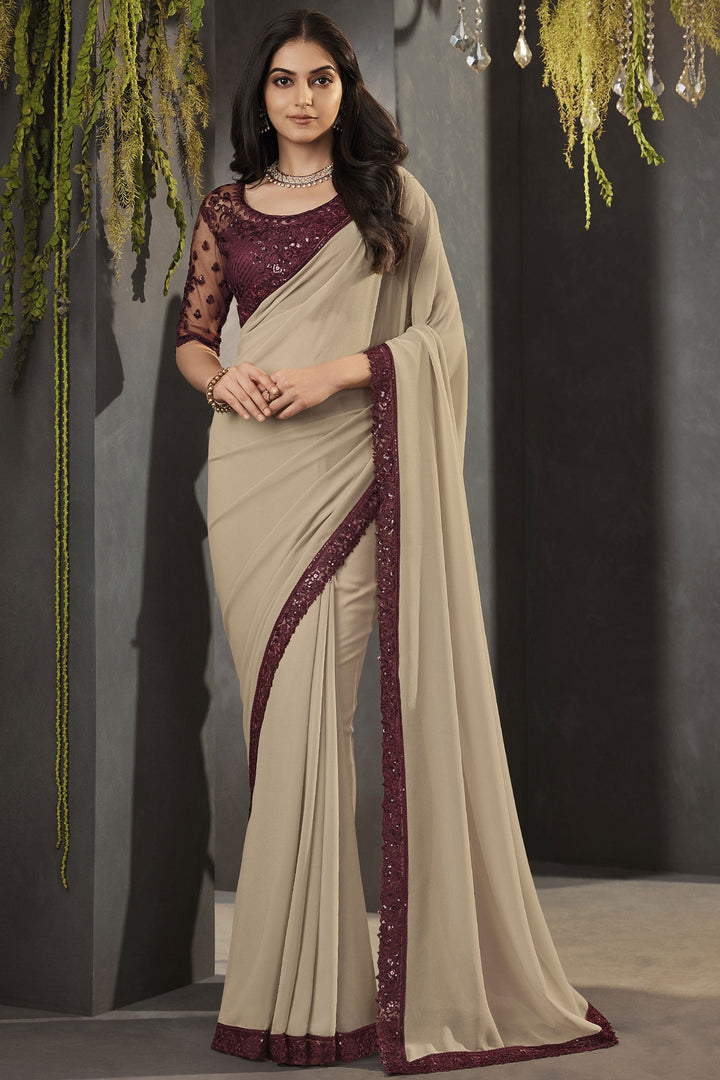 Glorious Look Lace Border Work Georgette Fabric Beige Color Saree With Embroidered Blouse