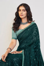 Load image into Gallery viewer, Teal Color Brasso Fabric Beguiling Embroidered And Stone Work Saree
