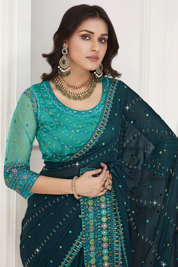 Excellent Chiffon Fabric Teal Color Saree With Embroidered Work