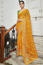 Load image into Gallery viewer, Embroidered and Stone Work Party Style Luxurious Organza Saree In Mustard Color
