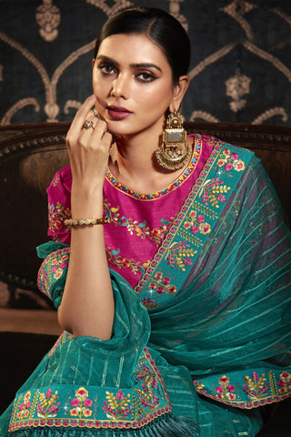 Engaging Cyan Color Organza Fabric Saree With Border Work