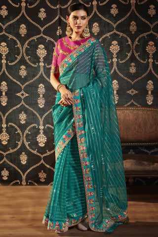 Engaging Cyan Color Organza Fabric Saree With Border Work