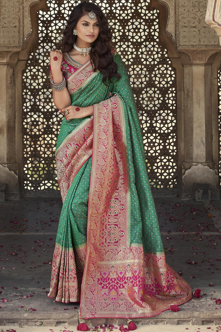 Green Color Puja Wear Elegant Weaving Work Silk Fabric Saree With Embroidered Blouse