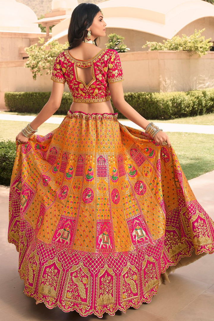 Wedding Wear Silk Fabric Designer Embroidered Lehenga Choli In Orange Color