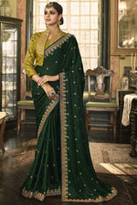 Load image into Gallery viewer, Elegant Dark Green Color Silk Saree With Embroidered Work Featuring Asmita Sood
