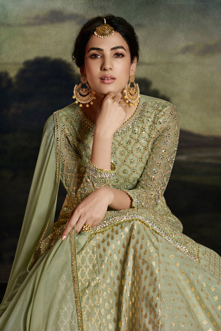 Sonal Chauhan Sea Green Color Fantastic Net Fabric Sharara Top Lehenga With Embroidered Work