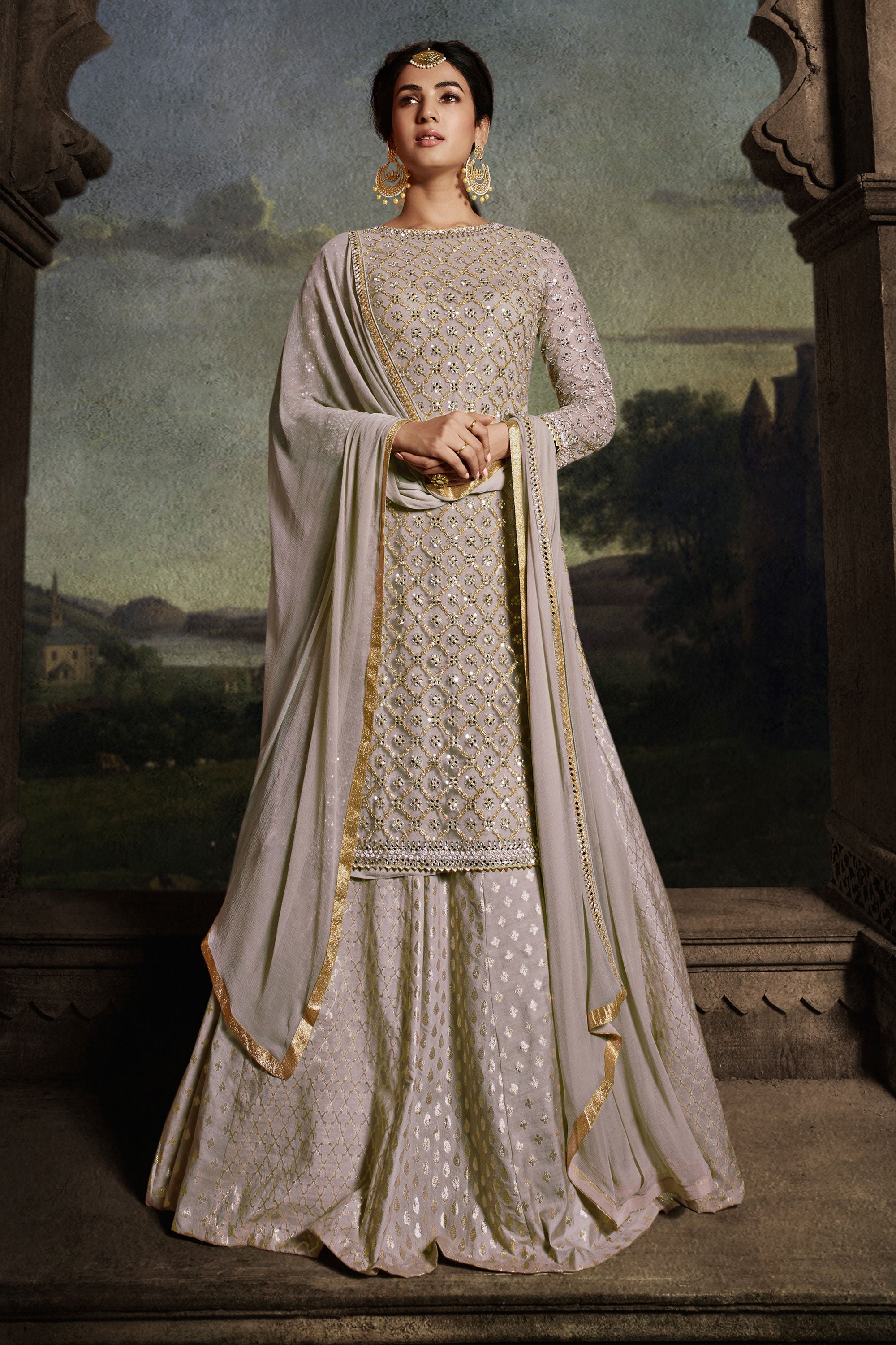 Sonal Chauhan Imperial Beige Color Net Fabric Sharara Top Lehenga With