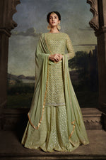 Load image into Gallery viewer, Sonal Chauhan Sea Green Color Fantastic Net Fabric Sharara Top Lehenga With Embroidered Work
