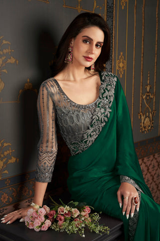 Chiffon Silk Luxurious Saree With Border Work In Dark Green Color