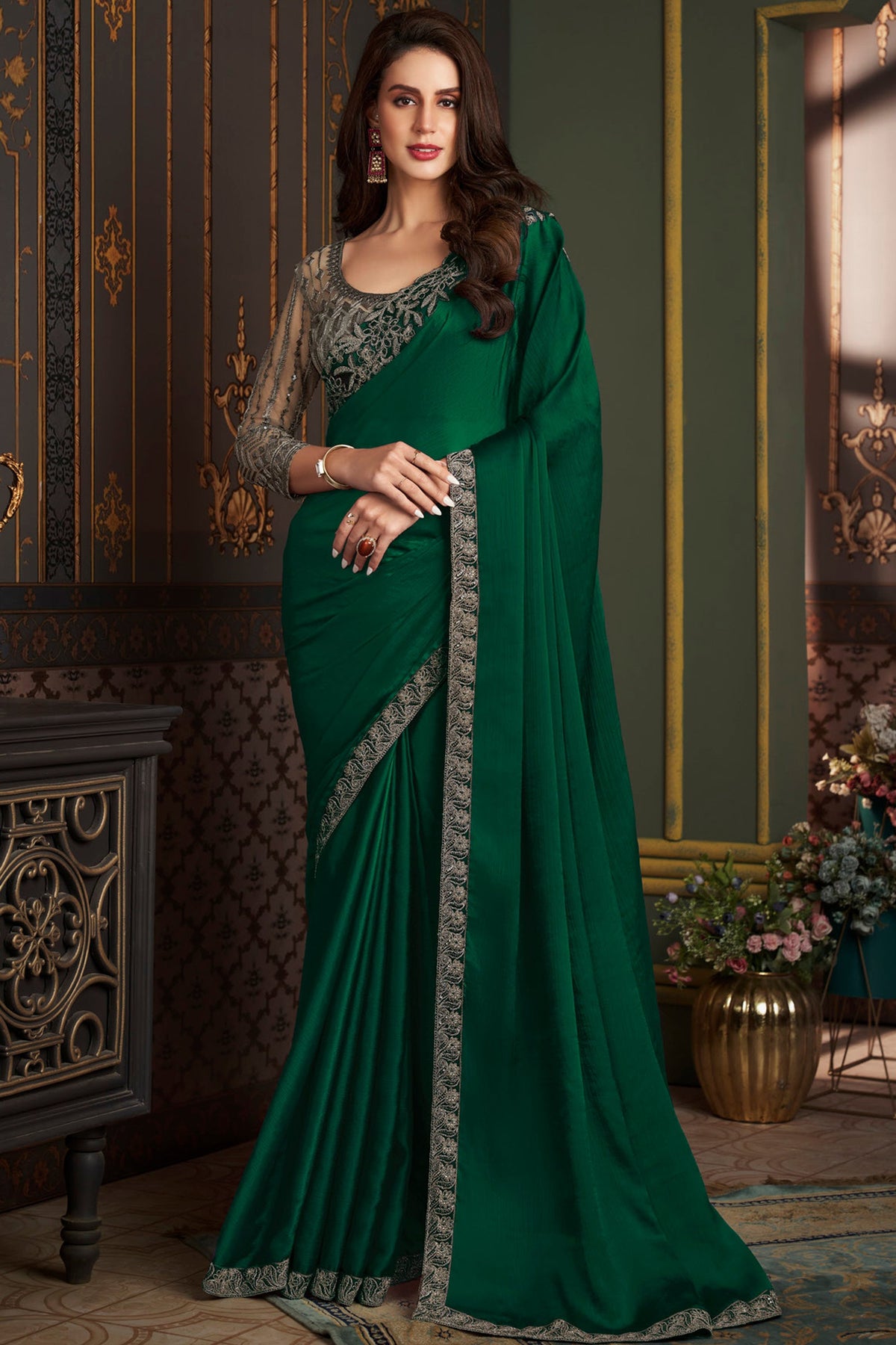 Chiffon Silk Luxurious Saree With Border Work In Dark Green Color