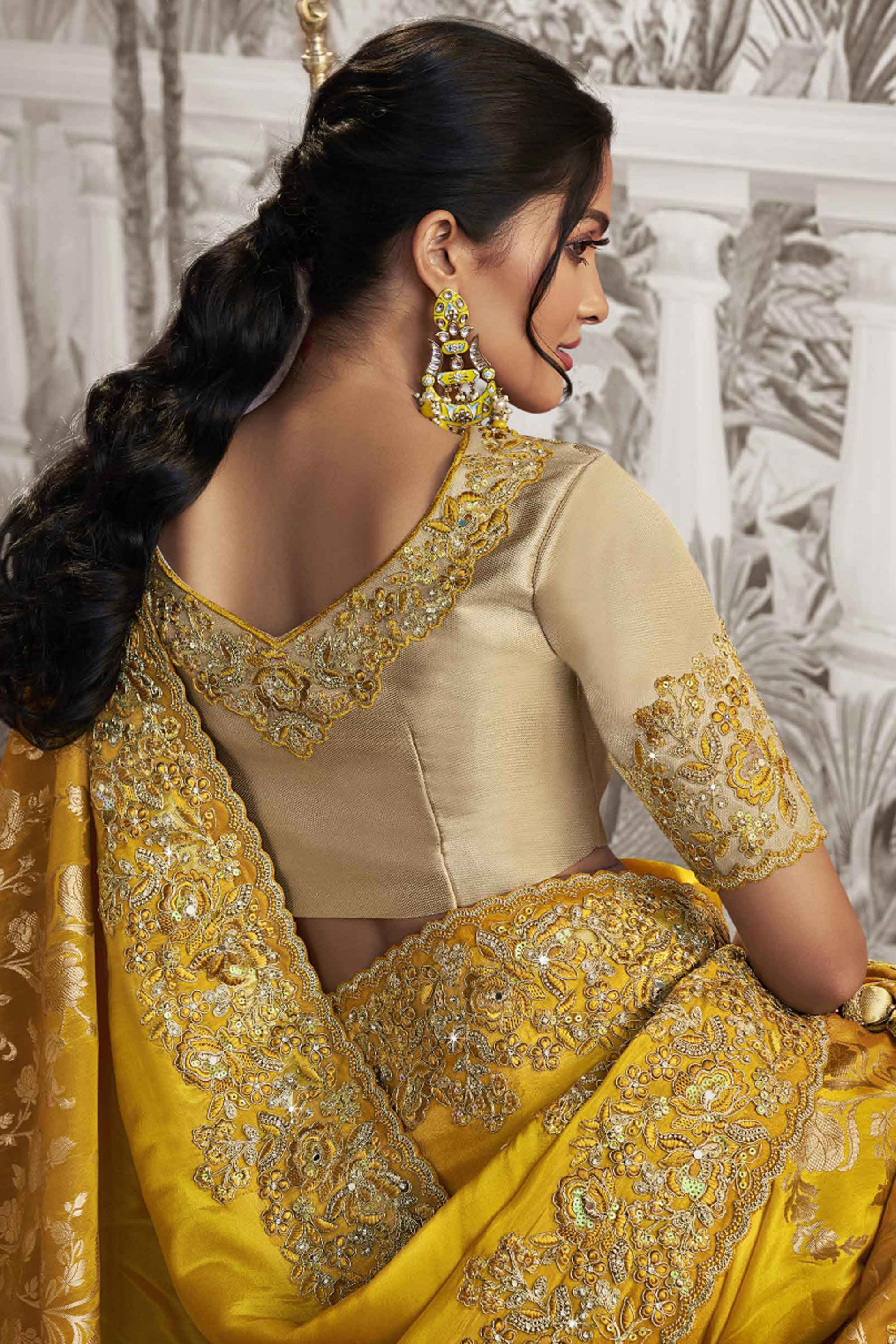 Appealing Heavy Embroidery Work Fancy Fabric Yellow Saree With Party Look Blouse