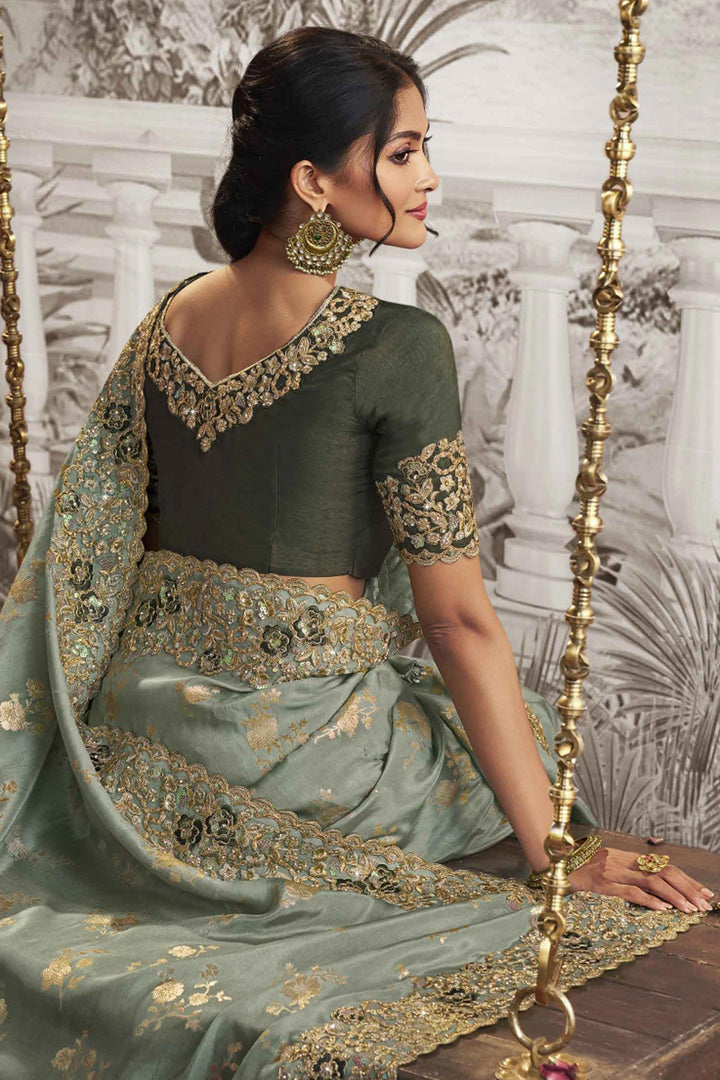 Creative Heavy Embroidery Work Sea Green Color Fancy Fabric Saree With Party Look Blouse